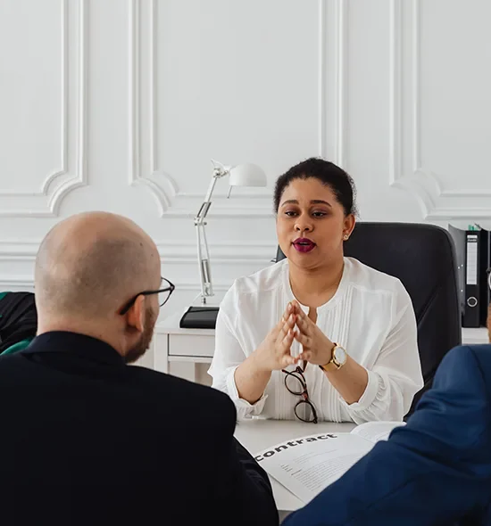 Canadian immigration consultant and recruitment professional helping an employer with LMIA job advertising in a modern office